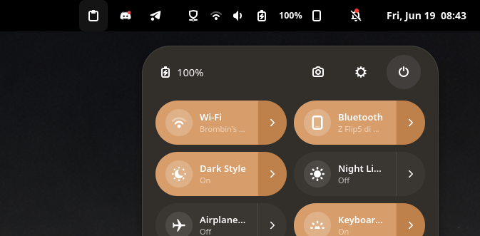 The connected phone in the top bar and the Bluetooth quick tile naming the device